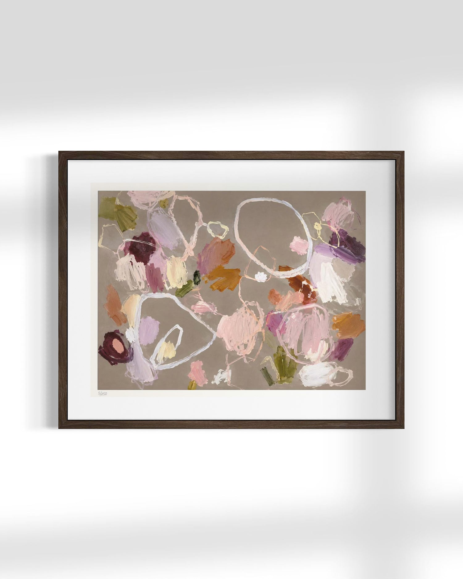 Framed abstract art print featuring a textured, painterly composition in soft pink, purple, brown, and white tones on a warm taupe background, housed in a dark brown wood frame with a white mat.