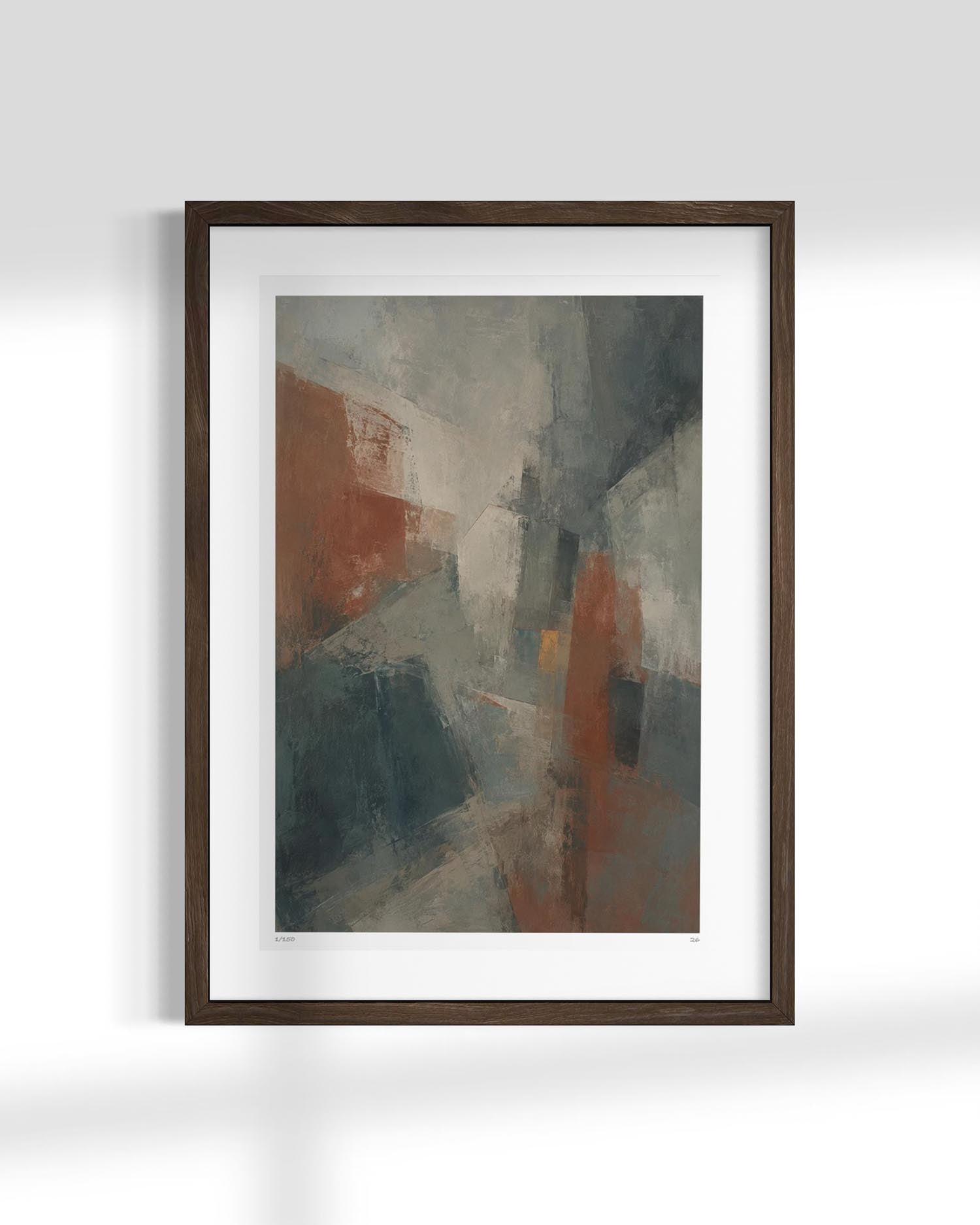 A framed abstract art print featuring a textured composition of gray, slate blue, and rust-orange brushstrokes, presented in a dark brown wooden frame with a white mat against a light gray wall.