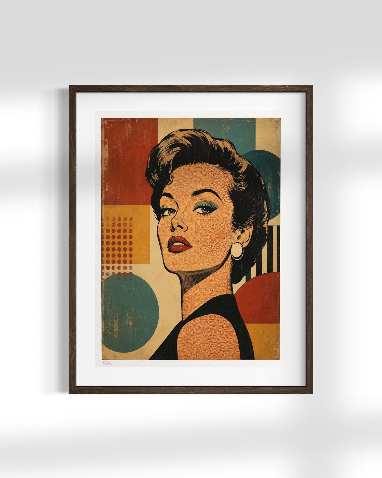 A framed art print featuring a retro-style portrait of a woman with bold geometric shapes in muted red, teal, beige, and black, displayed against a light gray wall.
