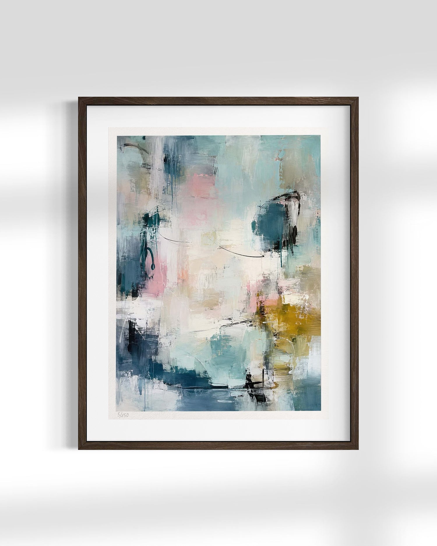 Framed abstract wall art featuring a modern expressionist painting with textured brushstrokes in shades of blue, teal, pink, white, and gold, presented in a dark brown frame with a white mat against a light gray wall.