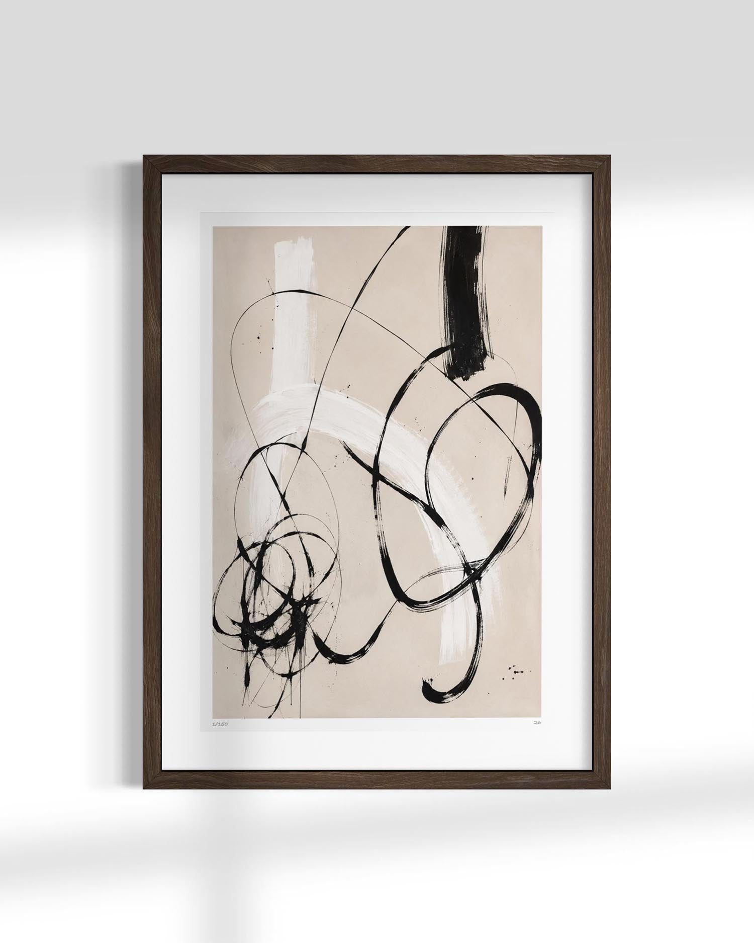 Framed abstract art print featuring black ink calligraphic swirls on a warm beige background, presented in a dark brown wood frame with a white mat against a light gray wall.