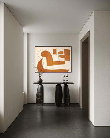 Modern interior with abstract art on the wall and a console table.