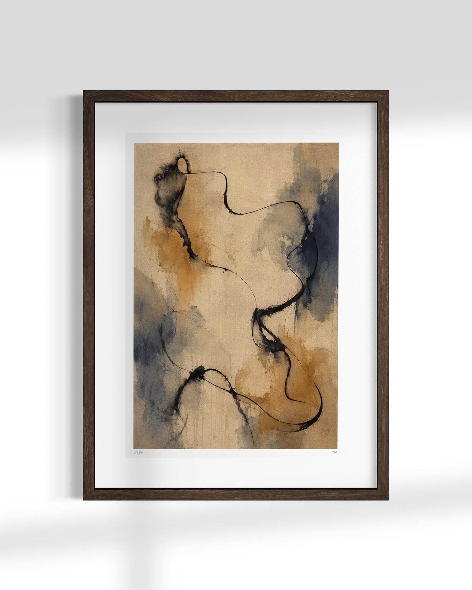 Framed abstract wall art print with flowing black line work over a warm beige and brown watercolor background, set in a dark wood frame with a white mat against a light gray wall.
