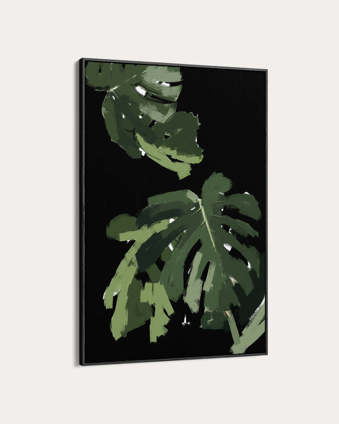 Framed artwork with green leaves on a black background
