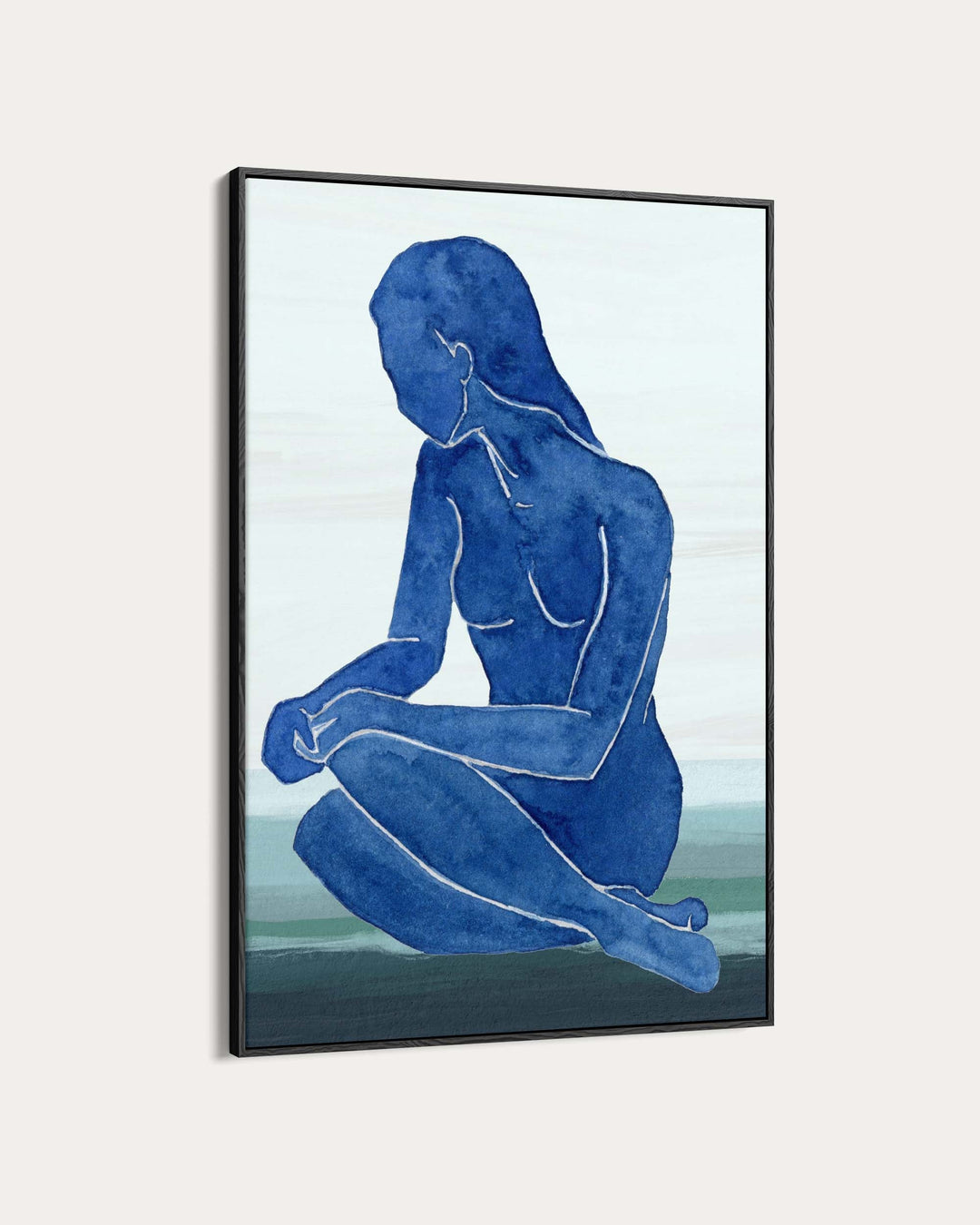 Framed artwork of a blue silhouette of a nude figure on a light background