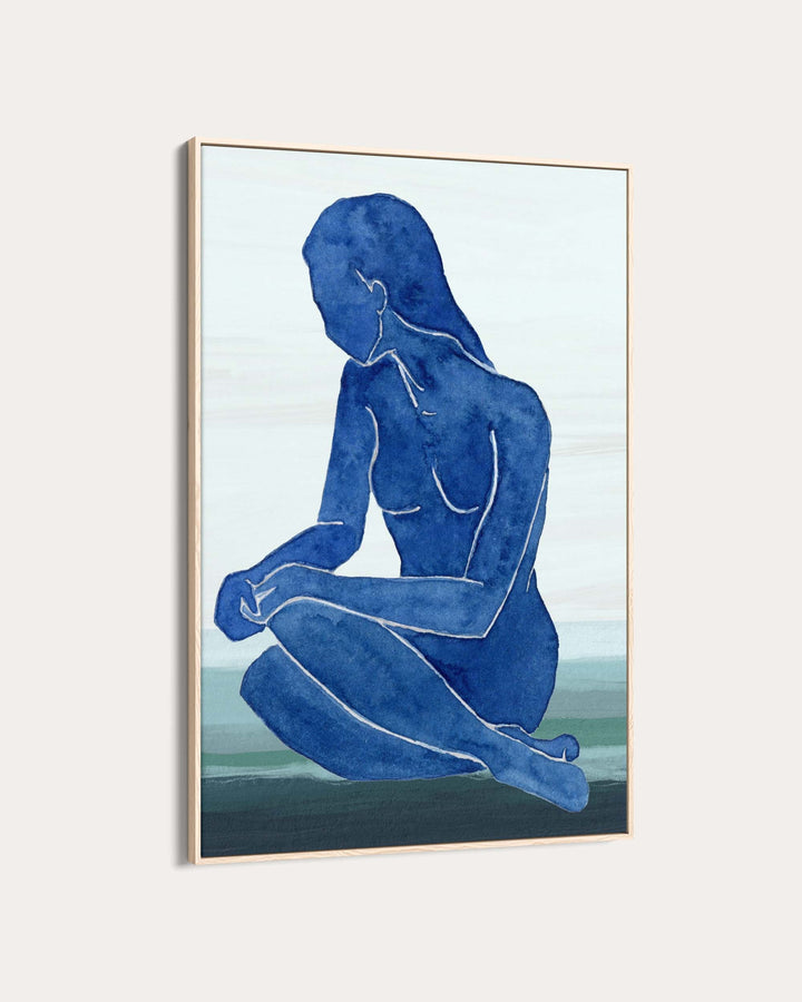 Framed artwork of a blue silhouette of a nude figure on a light background