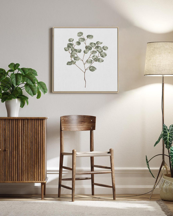 Nest living room with wooden cabinet, chair, and plants