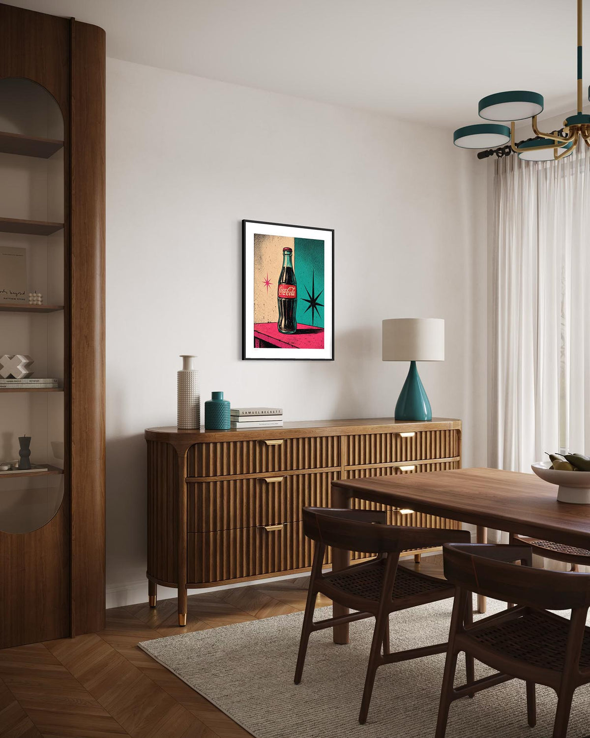 A framed pop-art print of a Coca-Cola bottle hanging on a white wall in a modern dining room with a wooden credenza, dining table, chairs, and a teal ceramic lamp.
