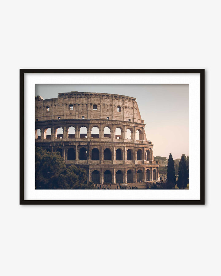 Framed photograph of the Colosseum in Rome on a white wall