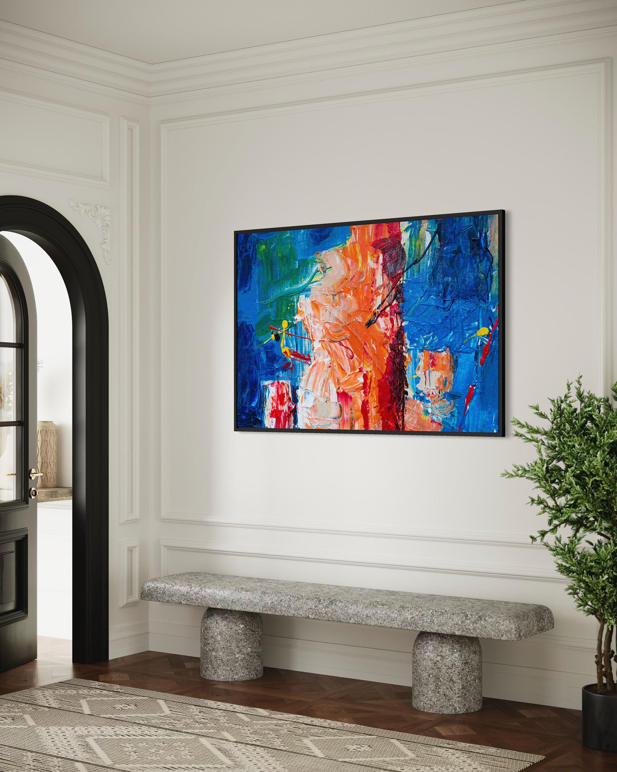 Abstract painting on a wall above a stone bench in a room with white walls and wooden floor.