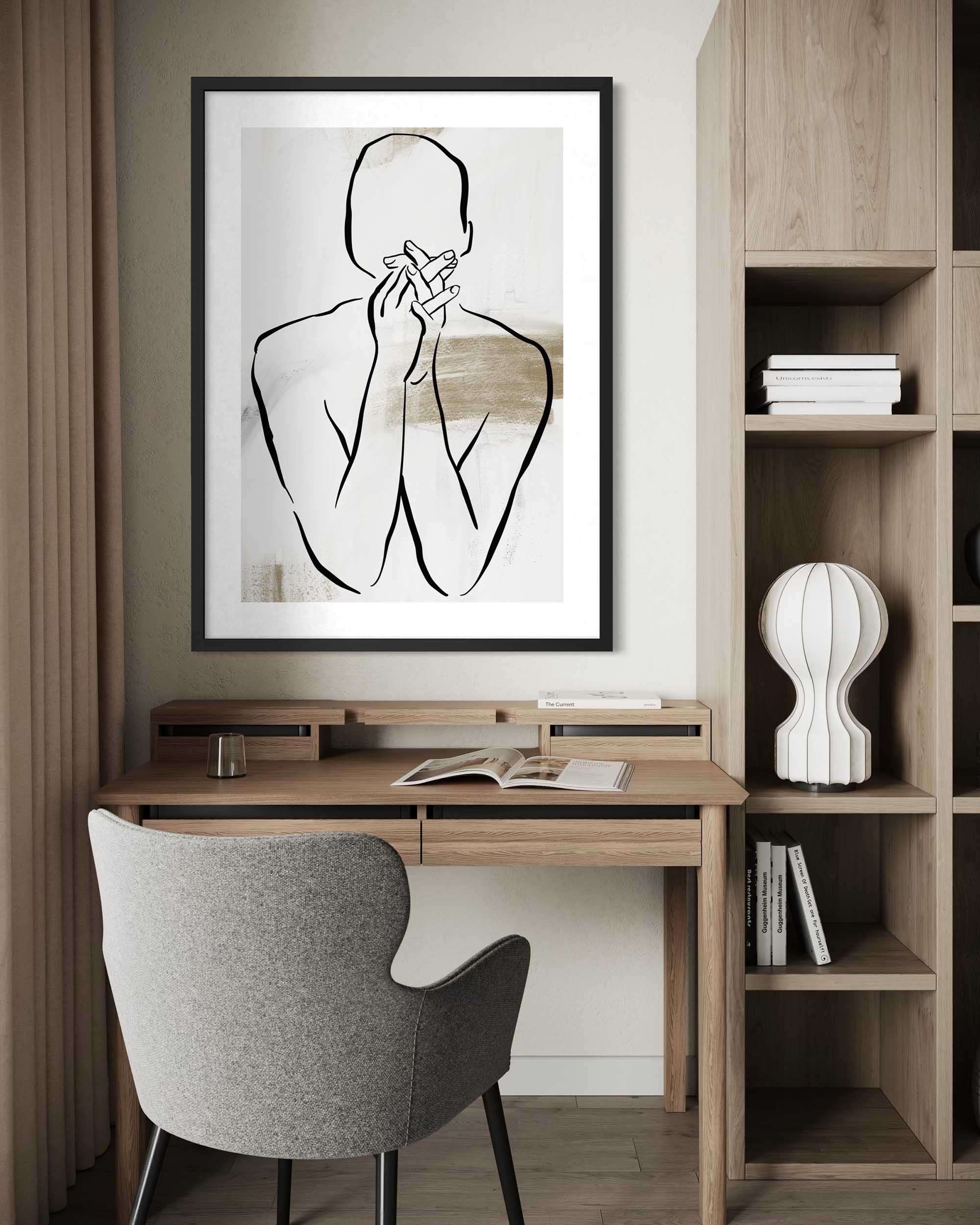 Modern home office with wooden desk, chair, and wall art.