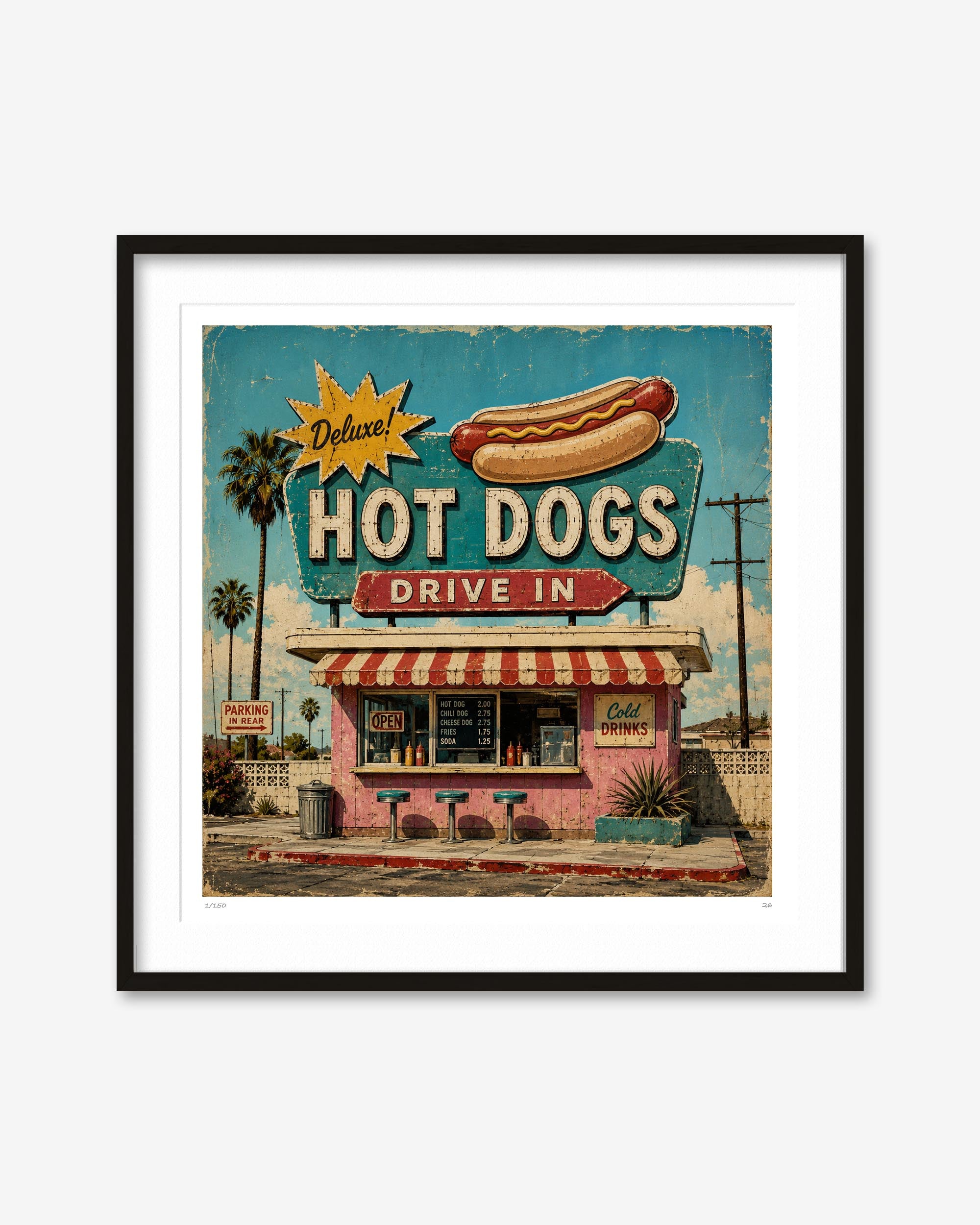 Framed wall art featuring a retro-style hot dog stand illustration with a large hot dog sign, pink building, palm trees, and a blue sky, shown in a black frame with white mat on a light gray background.
