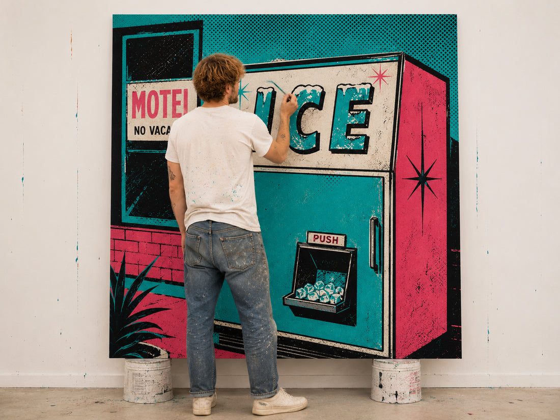 A man stands with his back to the camera, painting over a large pop-art style mural of a retro vending machine. The mural features bright teal, hot pink, black, and white colors, with the word 'ICE' painted on the machine.