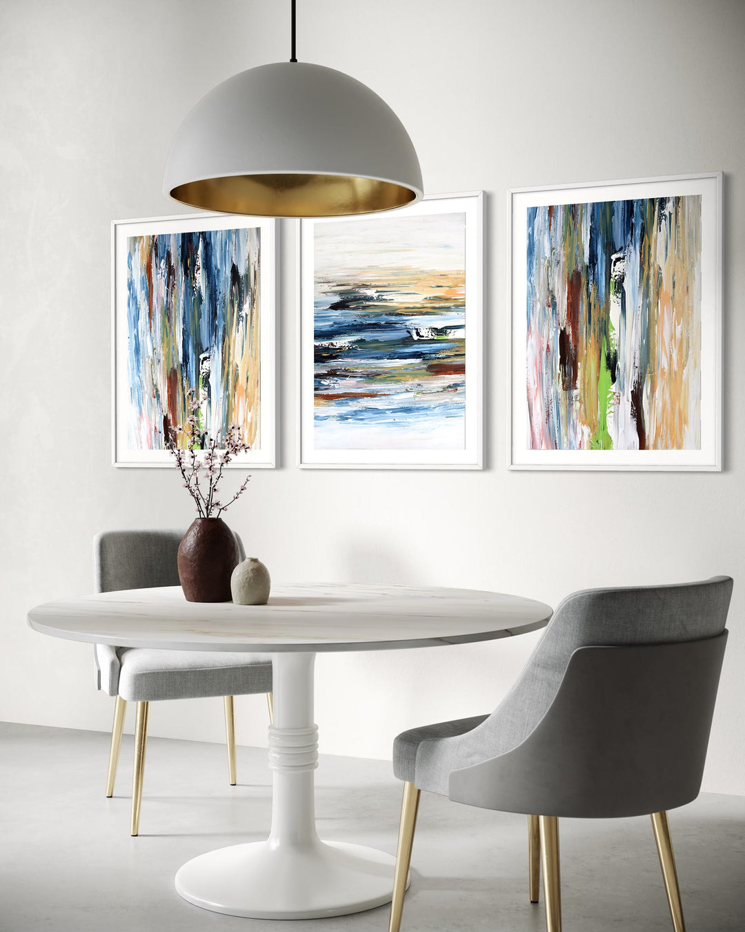 Dining room with a white table, gray chairs, and abstract art on the wall.