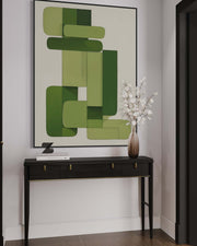 Modern interior with a console table, abstract green artwork, and a vase with white flowers.