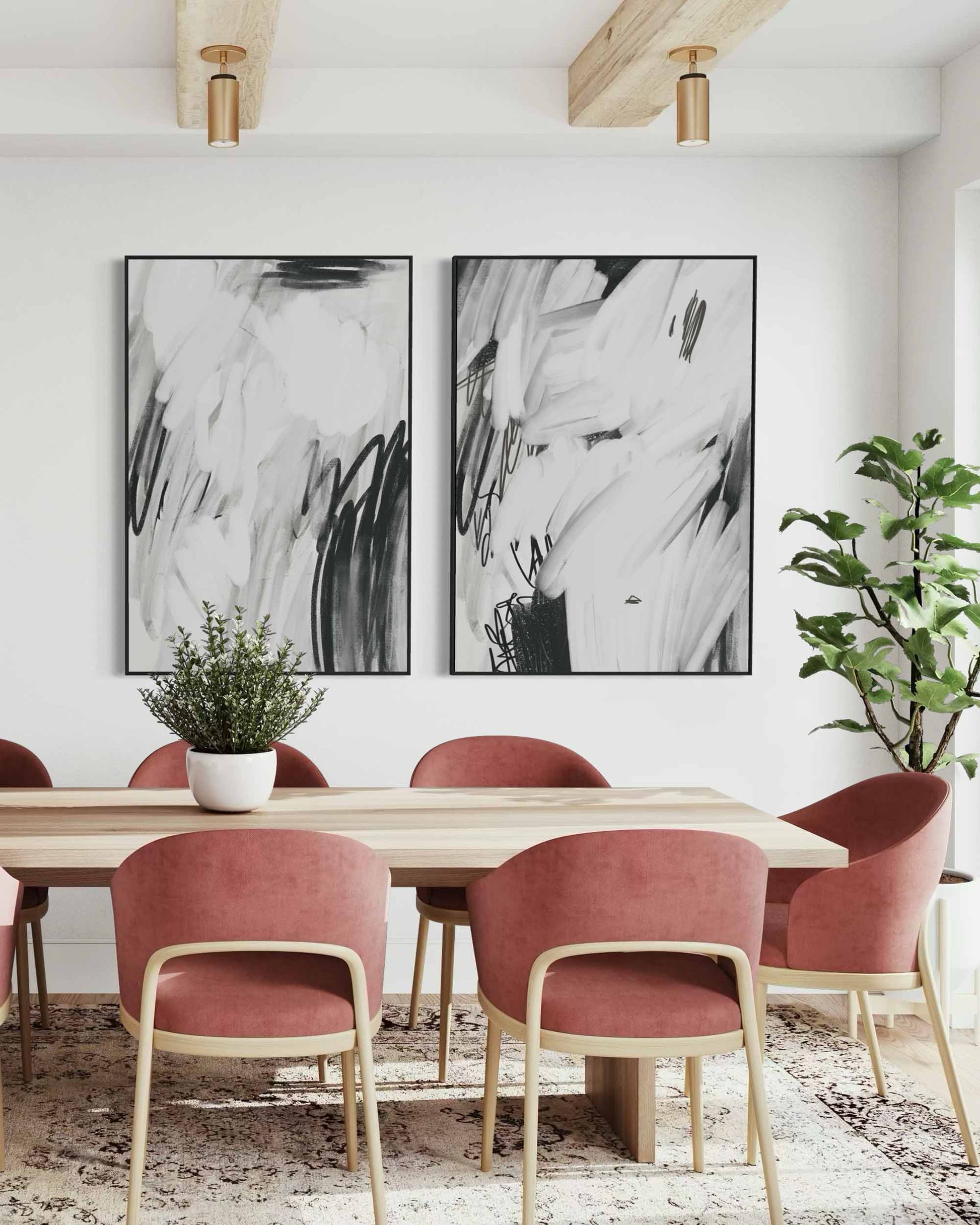 Dining room with abstract art on the wall, pink chairs, and a wooden table.