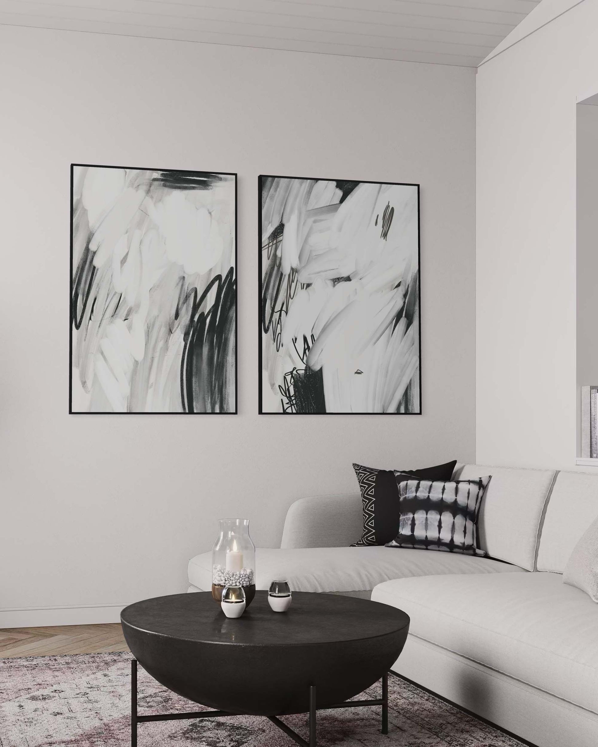 Modern living room with abstract art on the wall and a white sofa.