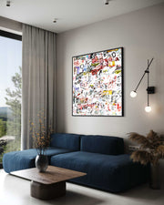 Modern living room with a blue sofa, abstract artwork, and decorative elements.