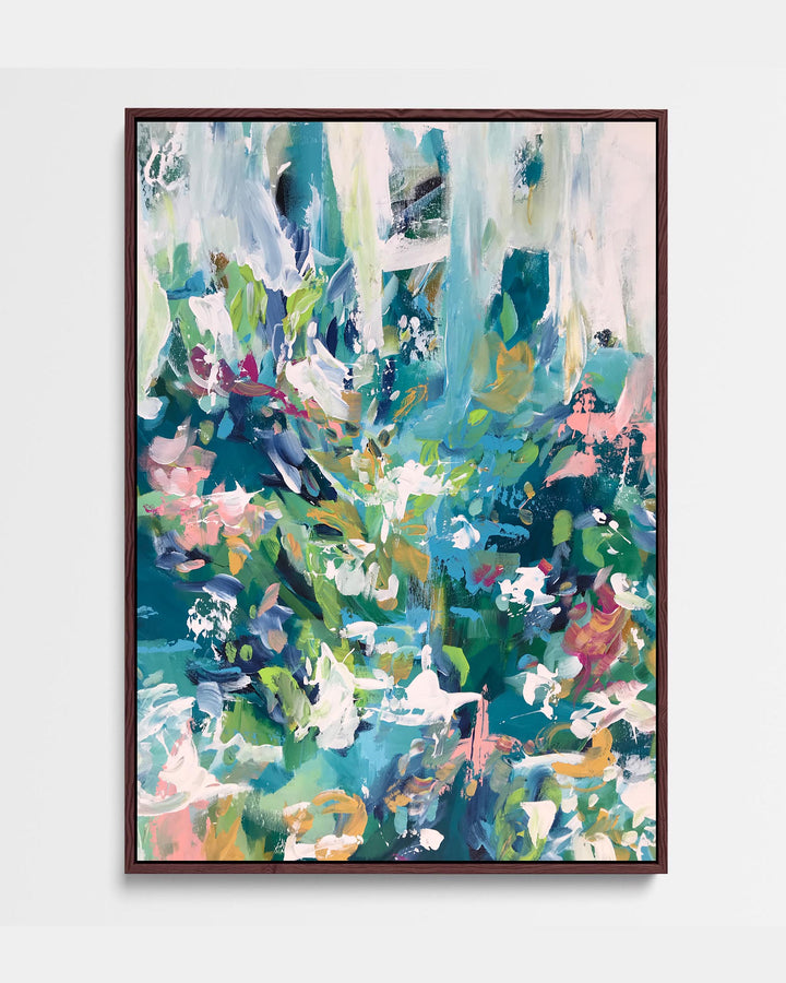 A framed canvas featuring an abstract floral motif in green and teal tones, with hints of pink and white, displayed against a white background.