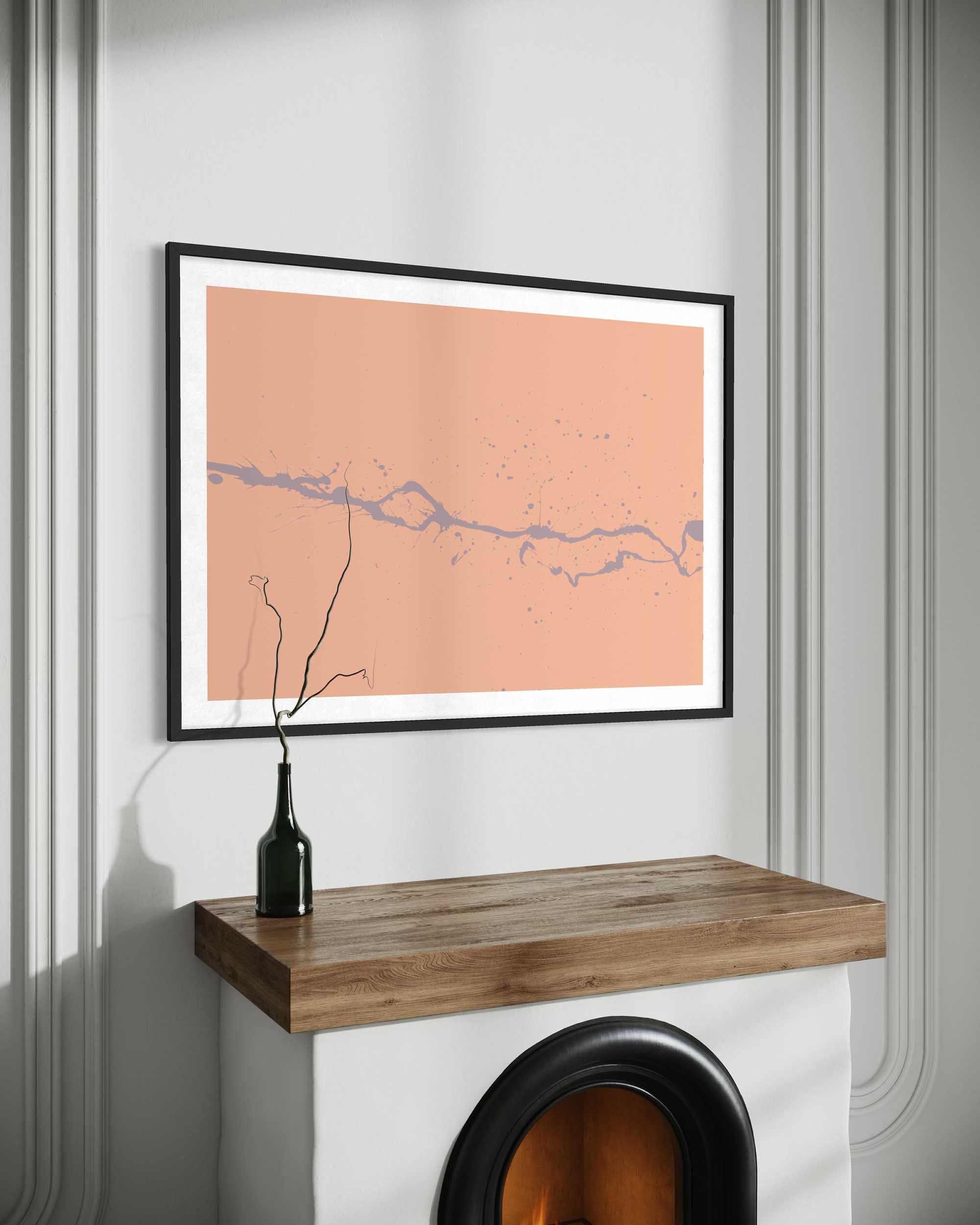 Framed map on a wall above a wooden shelf with a black vase.