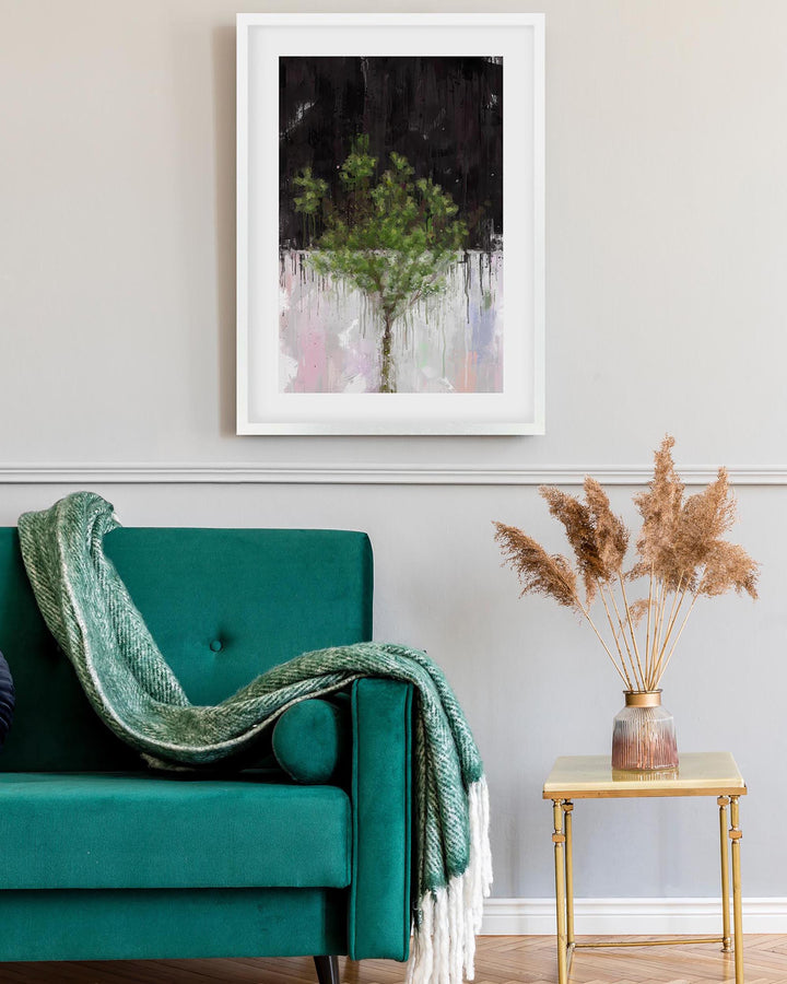 Teal armchair with a green blanket, framed artwork on the wall, and a small table with dried plants.