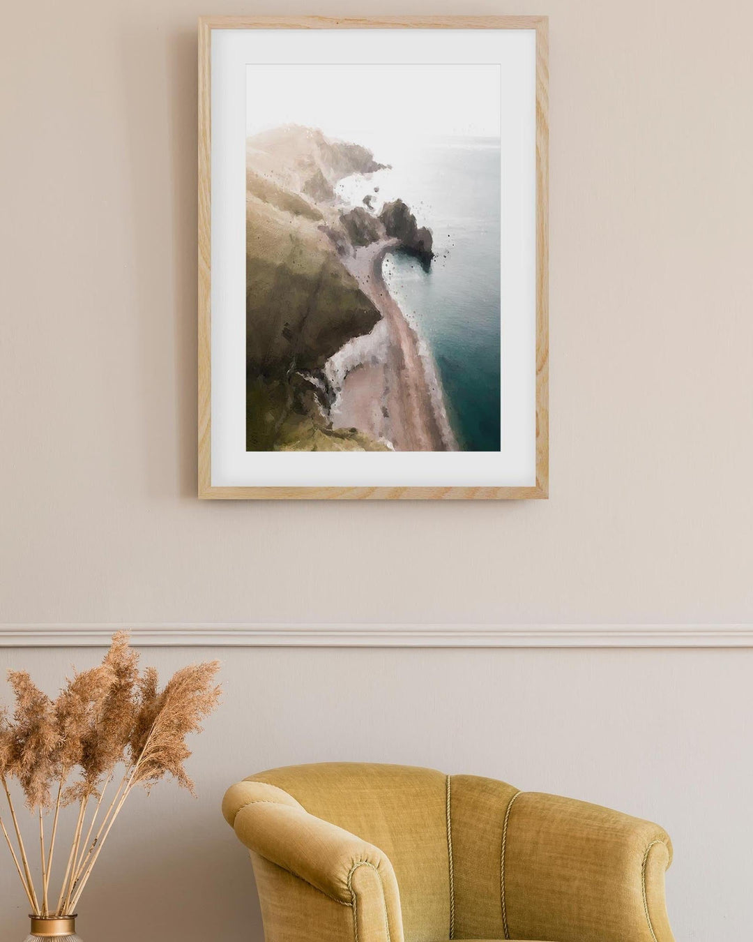 framed nature art print above an armchair