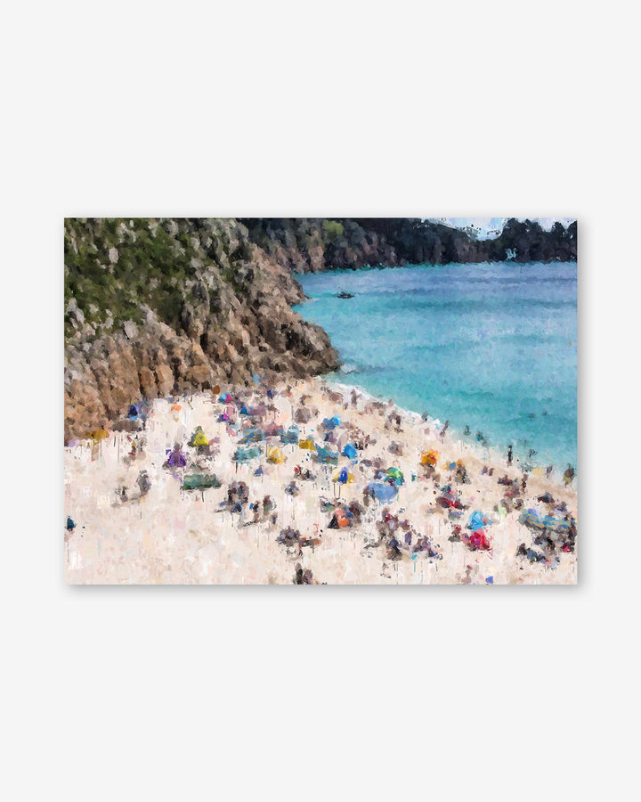 Beach scene with people and umbrellas near a body of water.