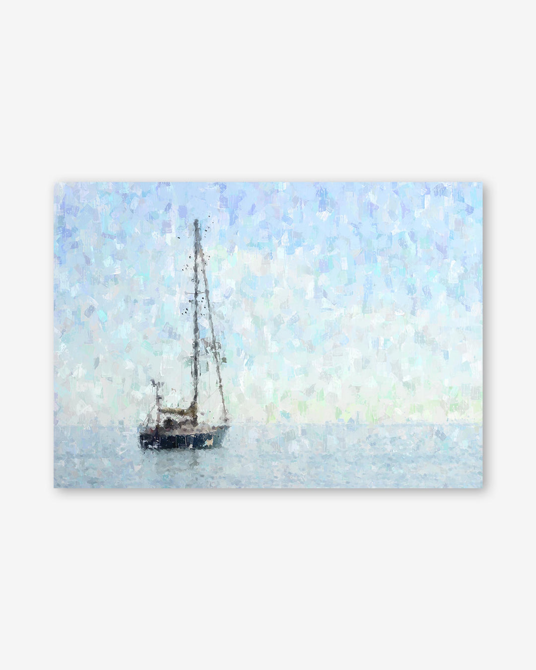 Sailboat on water with a light blue sky
