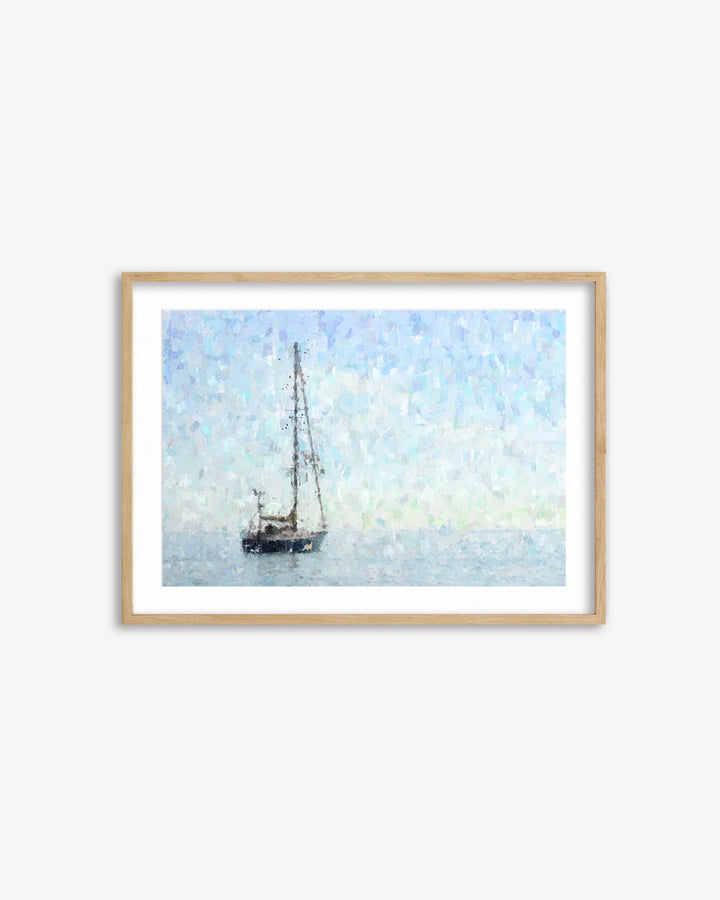 Framed artwork of a sailboat on water with a light blue sky.