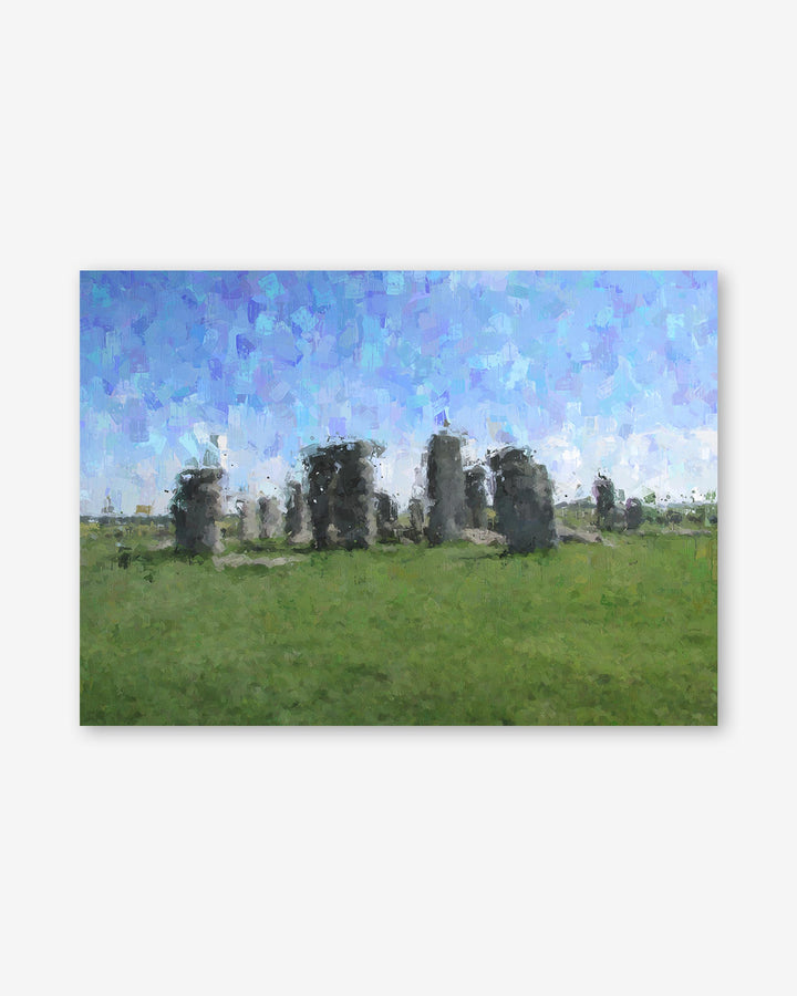 Stonehenge in a grassy field with a blue sky