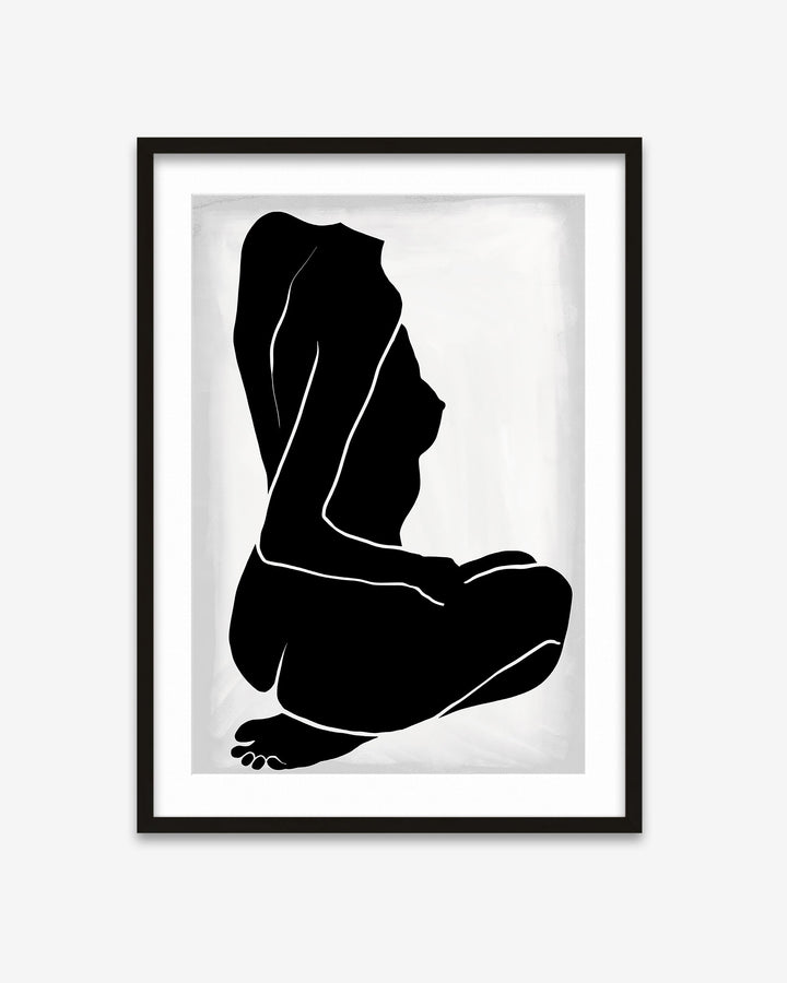 Framed black and white silhouette art print of a sitting figure on a white background