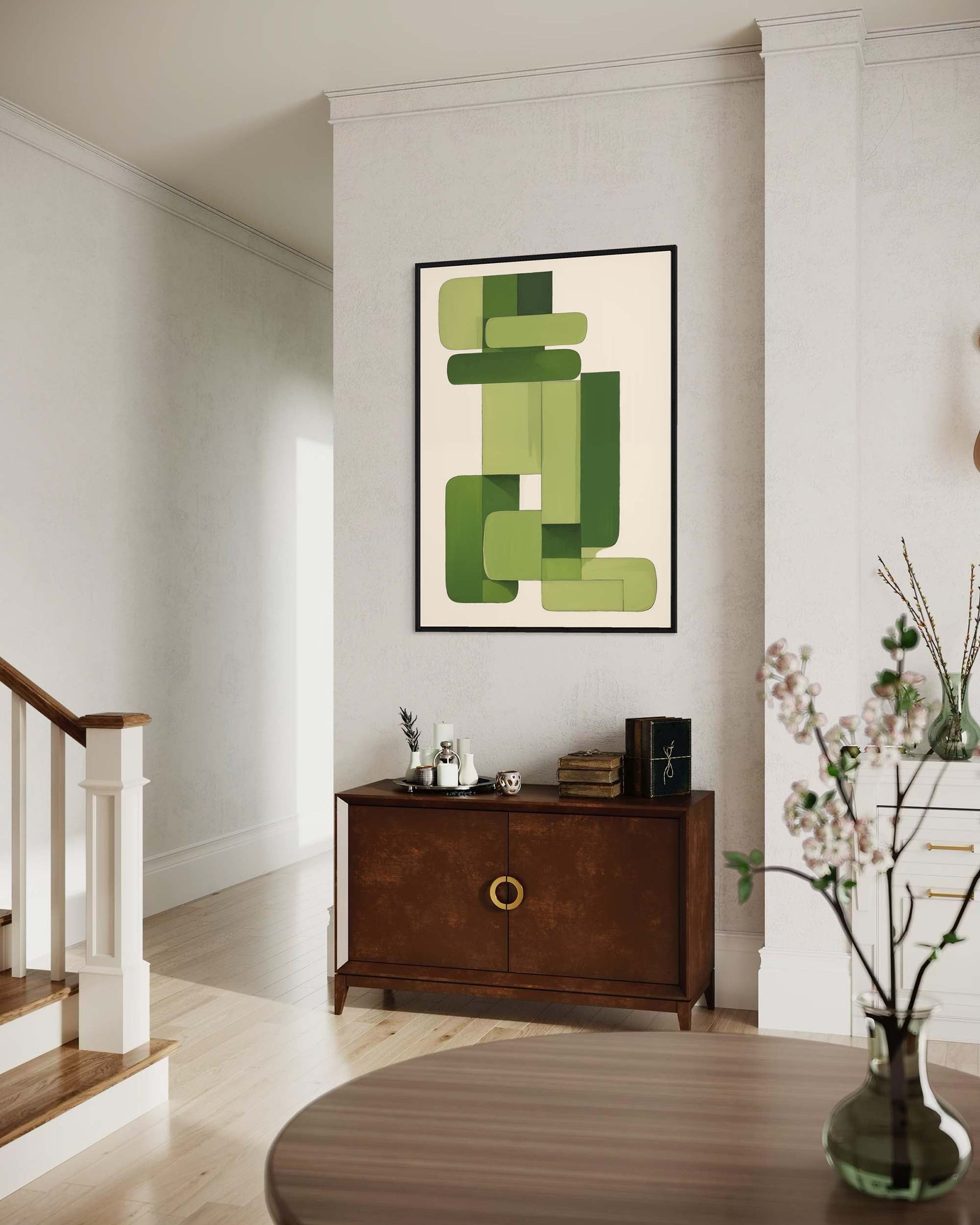 Modern interior with abstract green artwork on a wall above a wooden cabinet.