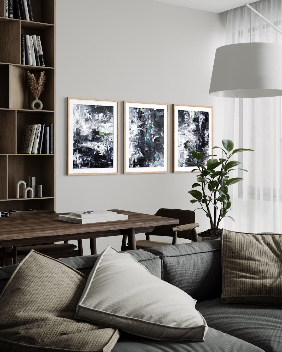 Modern living room with a sofa, bookshelf, and wall art