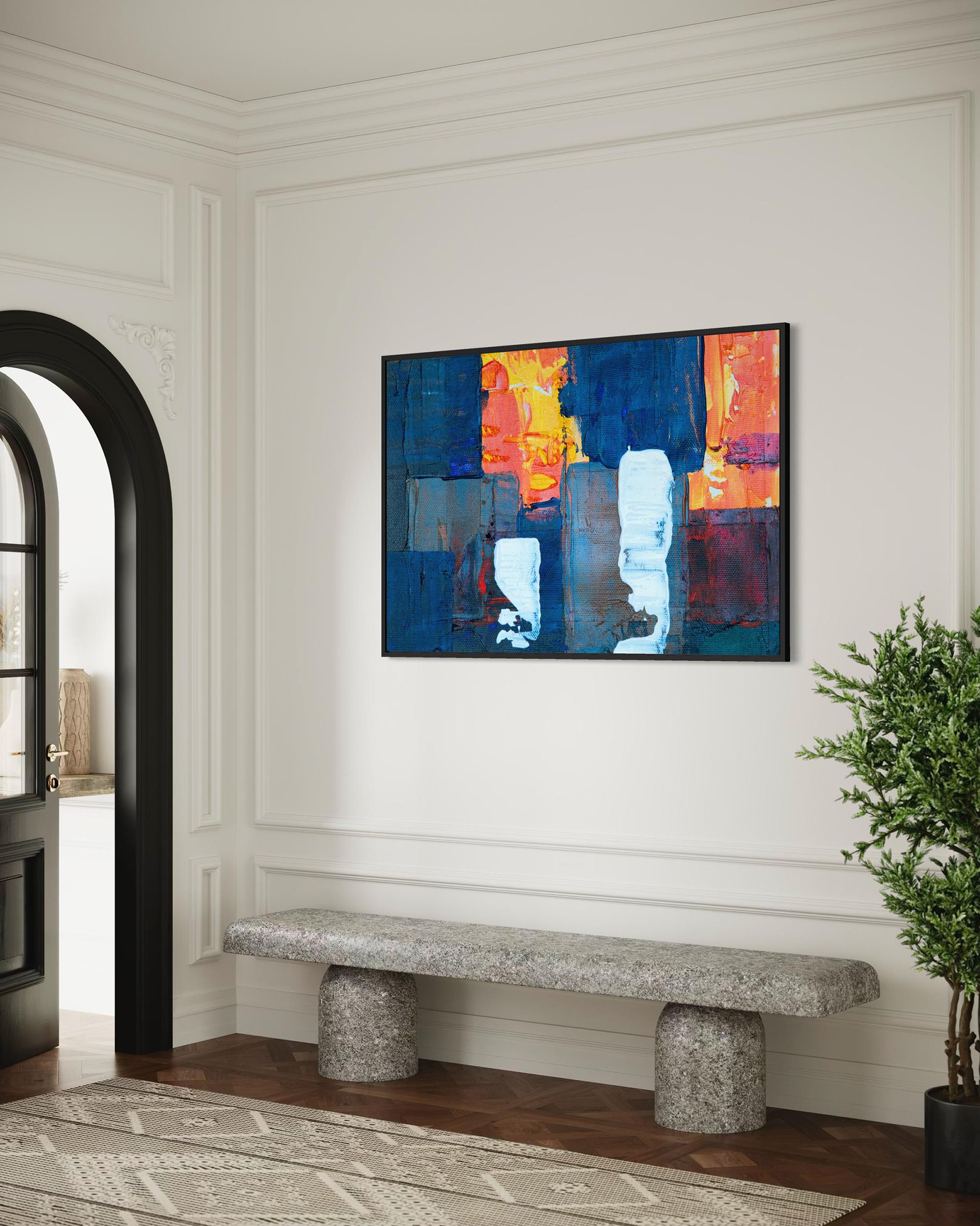 Abstract painting on a wall above a stone bench in a room with a plant and open door.
