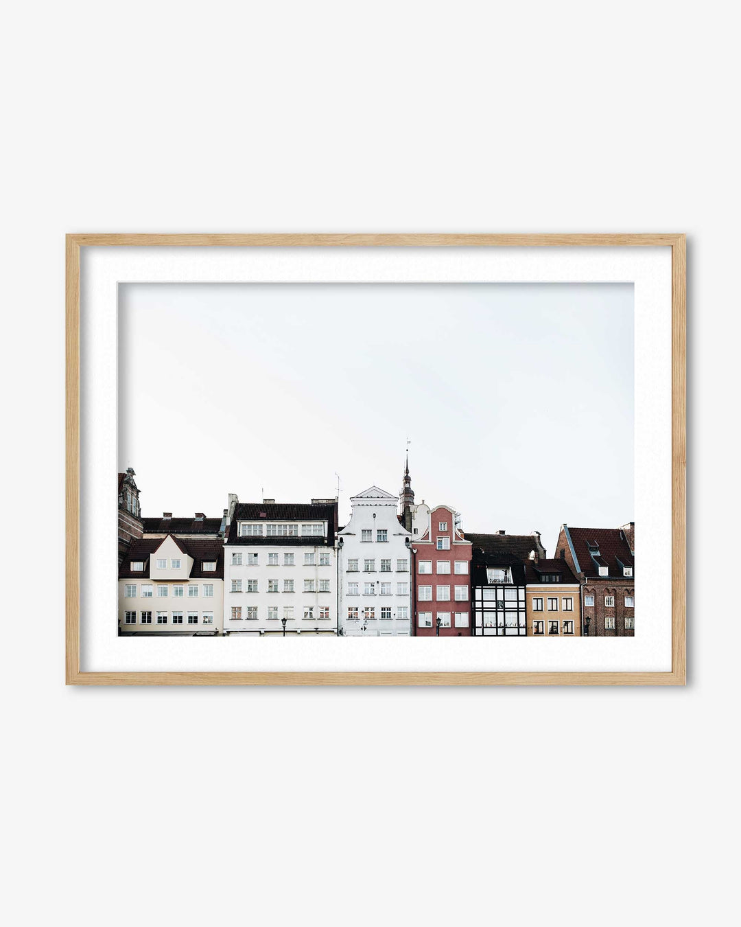 Framed artwork of a cityscape with buildings on a white background