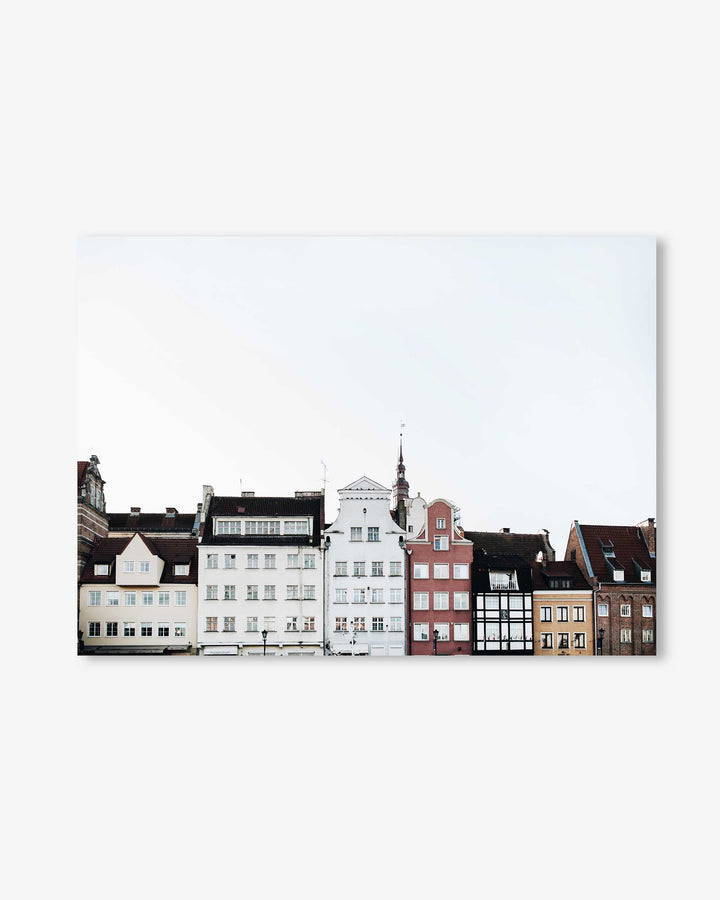 Row of colorful houses on a white background