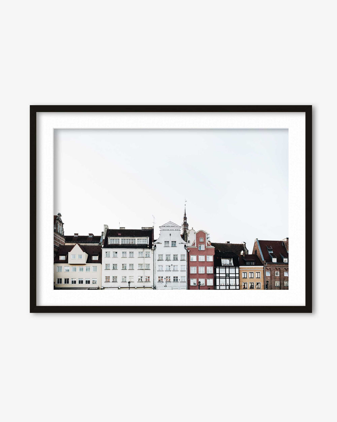Framed artwork of a cityscape with buildings on a white background