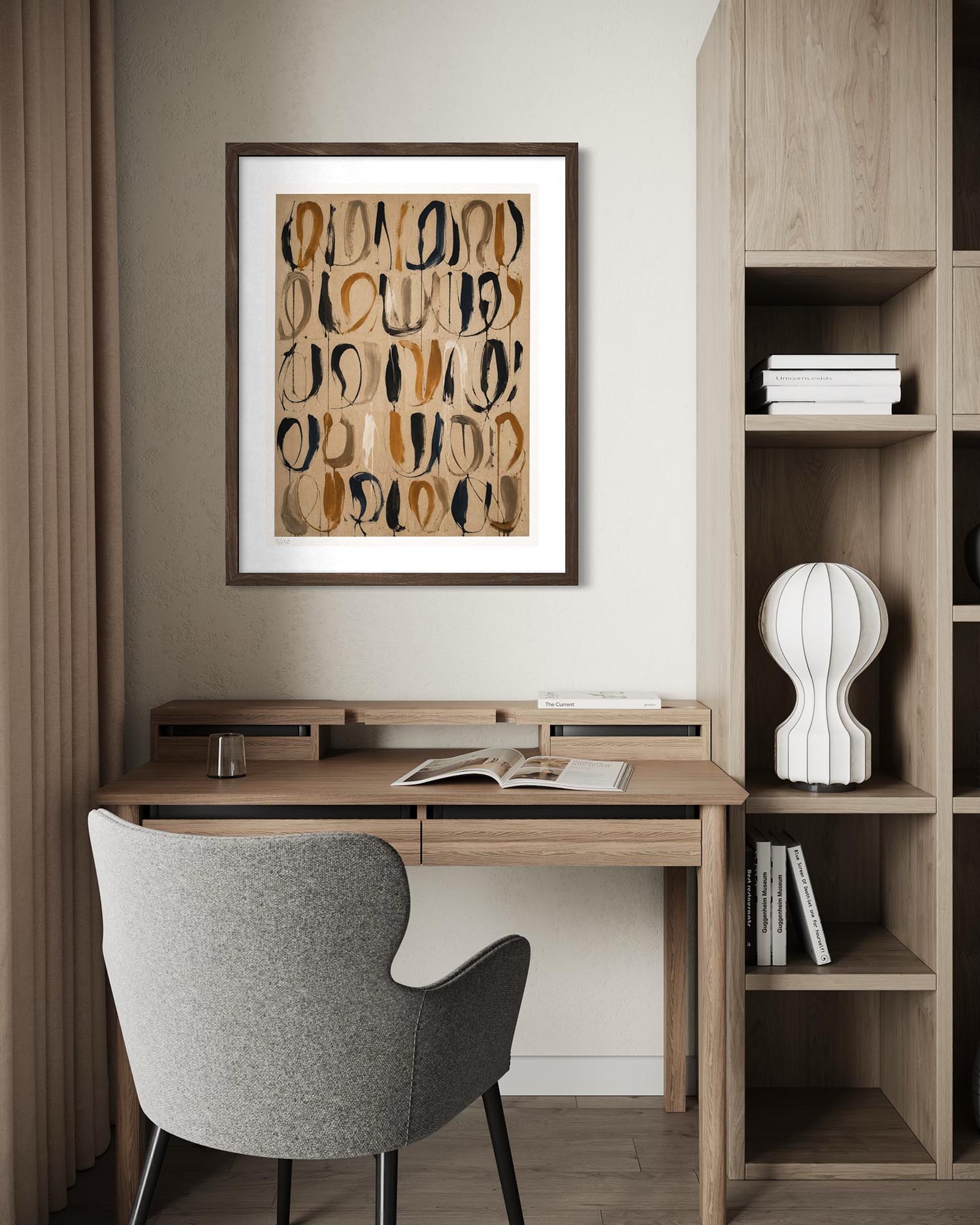 A framed abstract art print with organic flowing lines in beige, brown, and black hangs on a light gray wall above a wooden desk with a gray upholstered chair. The room includes a wooden shelving unit with books and a white sculptural vase.