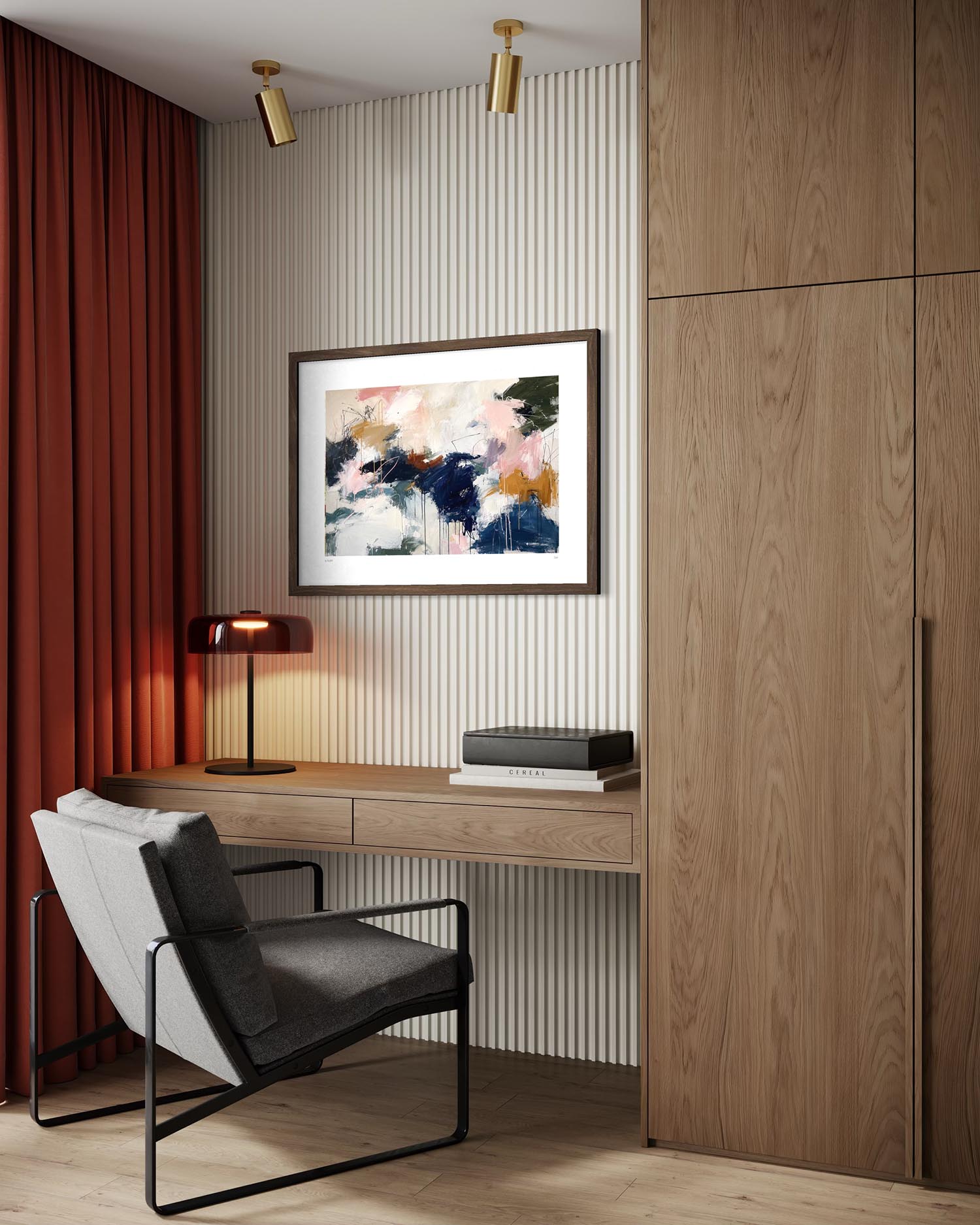 An abstract framed painting with blue, pink, and orange brushstrokes hangs on a ribbed beige wall above a wooden desk in a modern home office setting with a gray armchair and red curtains.