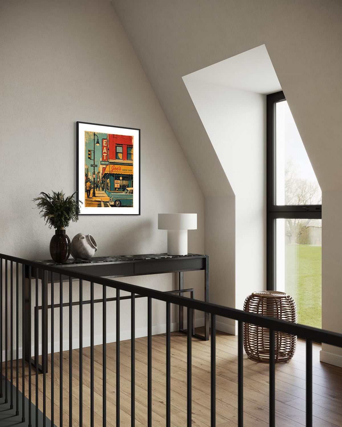 A framed art print depicting a colorful vintage street scene hangs on a beige wall in a modern attic room with a black console table, white lamp, and large window.