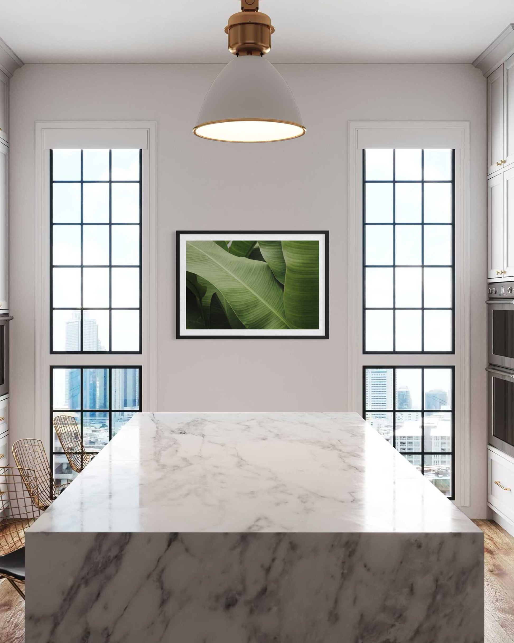 Modern kitchen with marble island, large windows, and a green leafy plant artwork.
