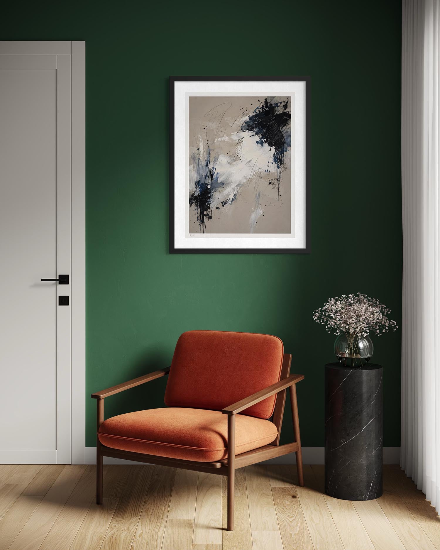 A framed abstract art print with black, white, and gray brushstrokes on a beige background, hanging on a dark green wall above a rust-orange armchair in a modern room setting.