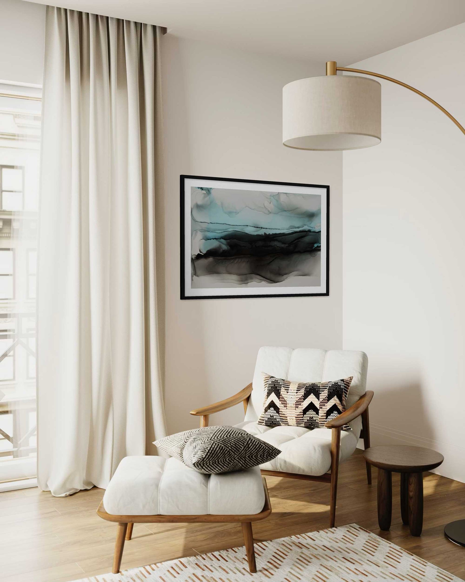 Modern living room with a white armchair, ottoman, and abstract art on the wall.