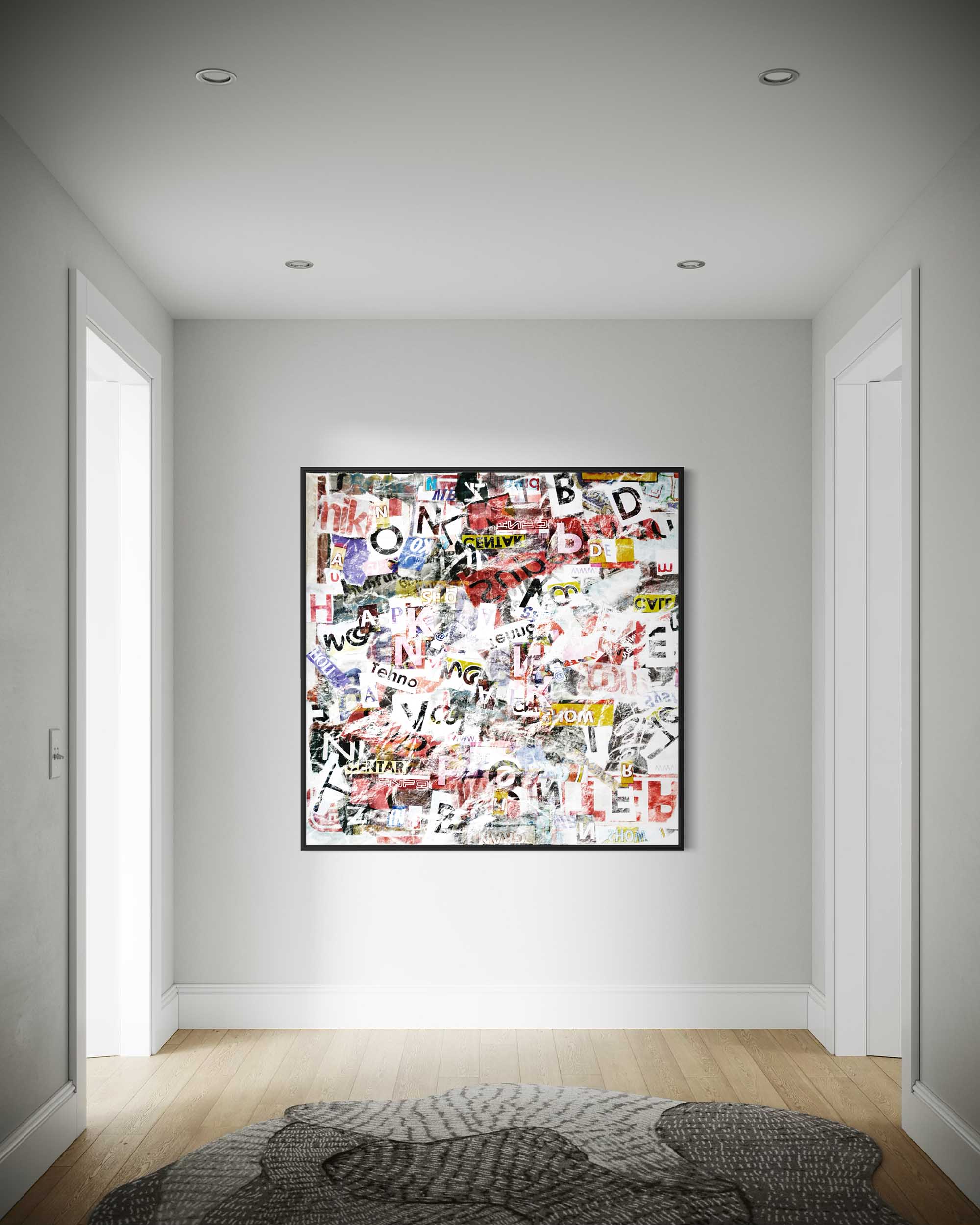 Abstract art piece on a wall in a minimalistic room with light gray walls and wooden flooring.