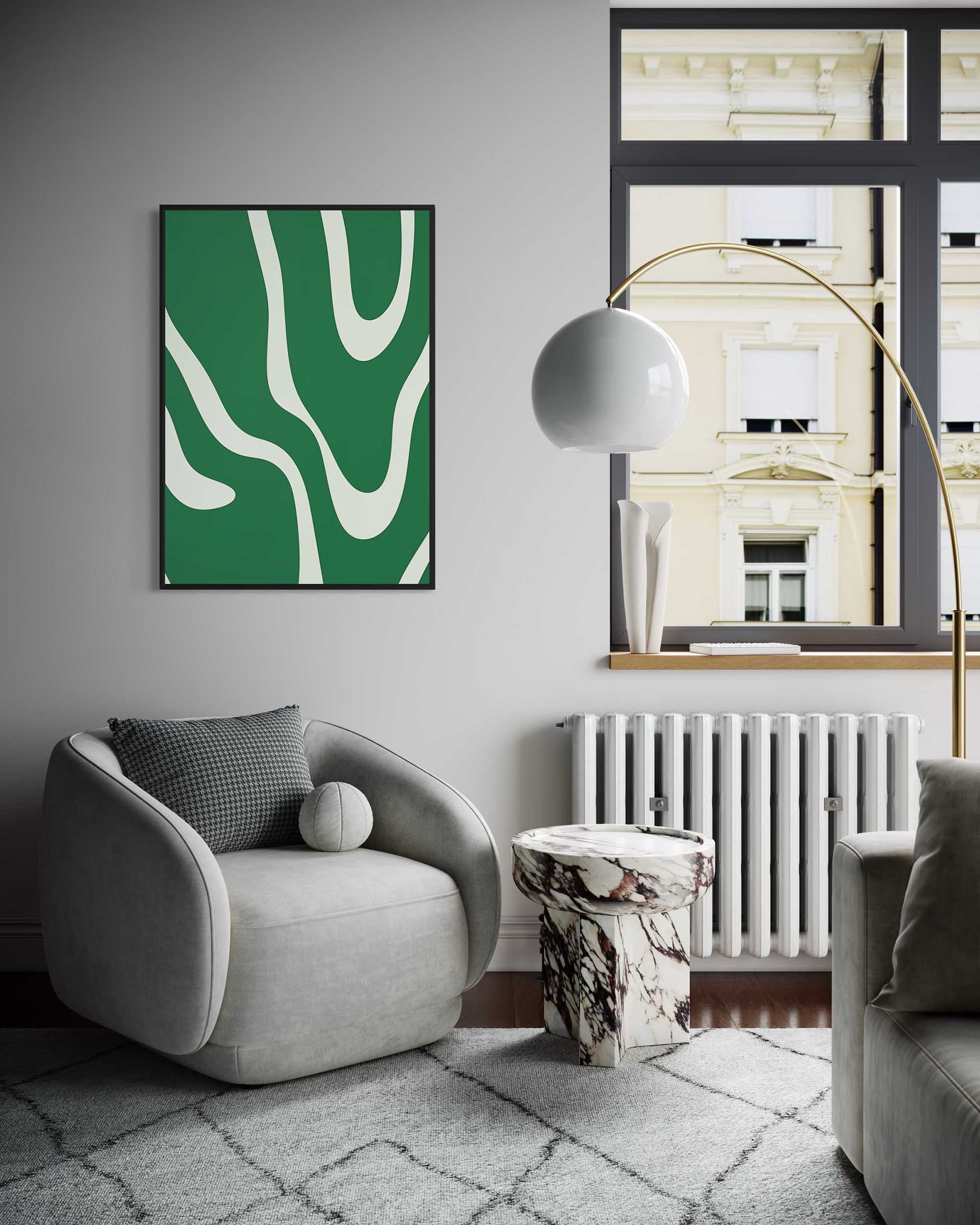 Modern living room with a gray armchair, abstract green painting, and decorative elements.