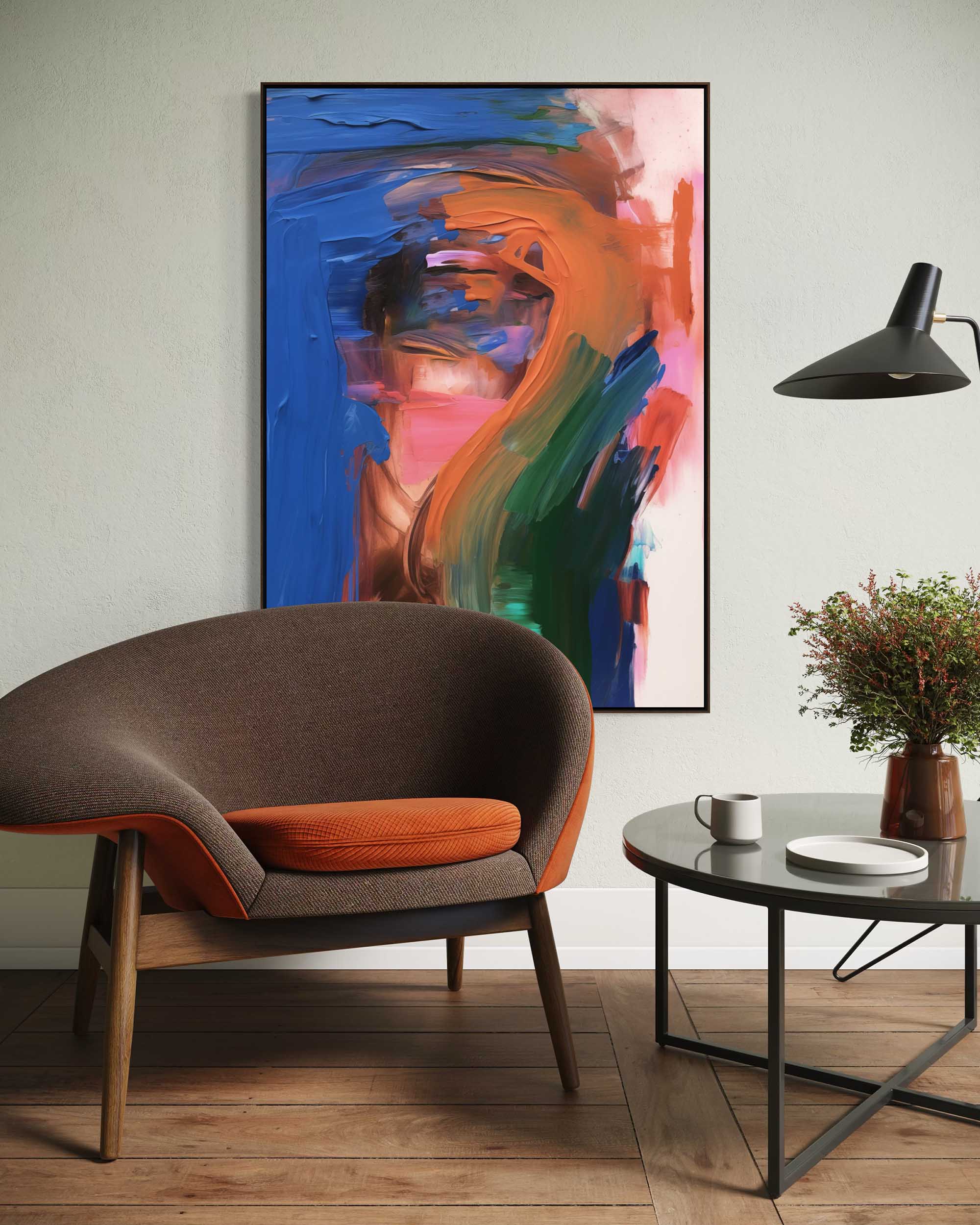 Modern living room with a brown chair, round table, and abstract painting on the wall.