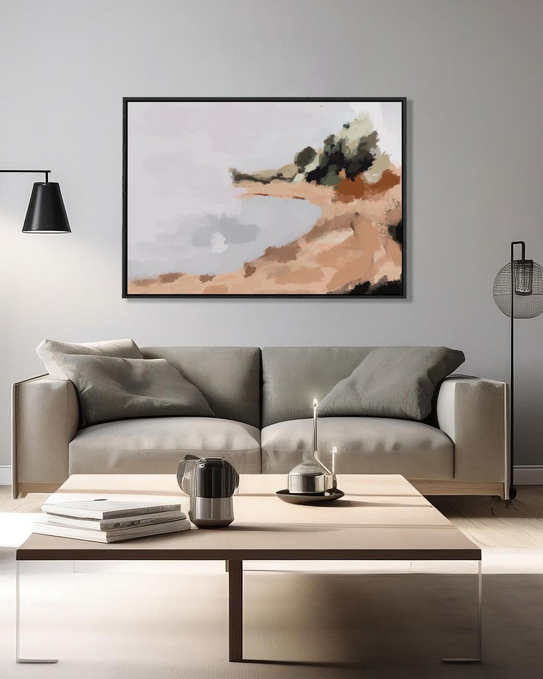 Modern living room with a gray sofa, abstract painting, and coffee table.