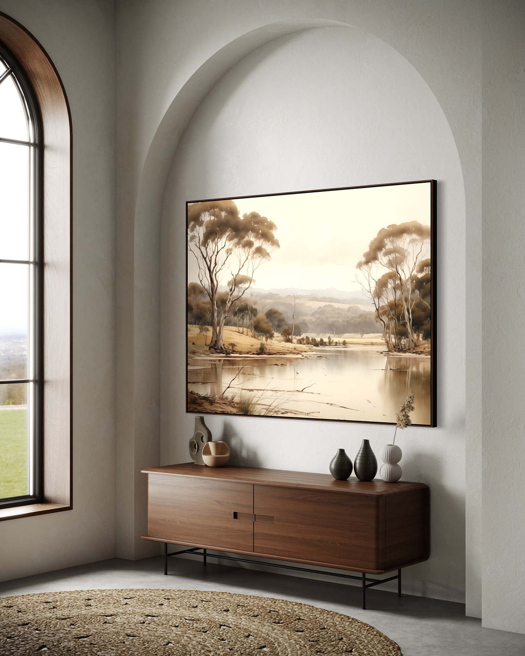 Modern interior with a large landscape painting above a wooden sideboard.