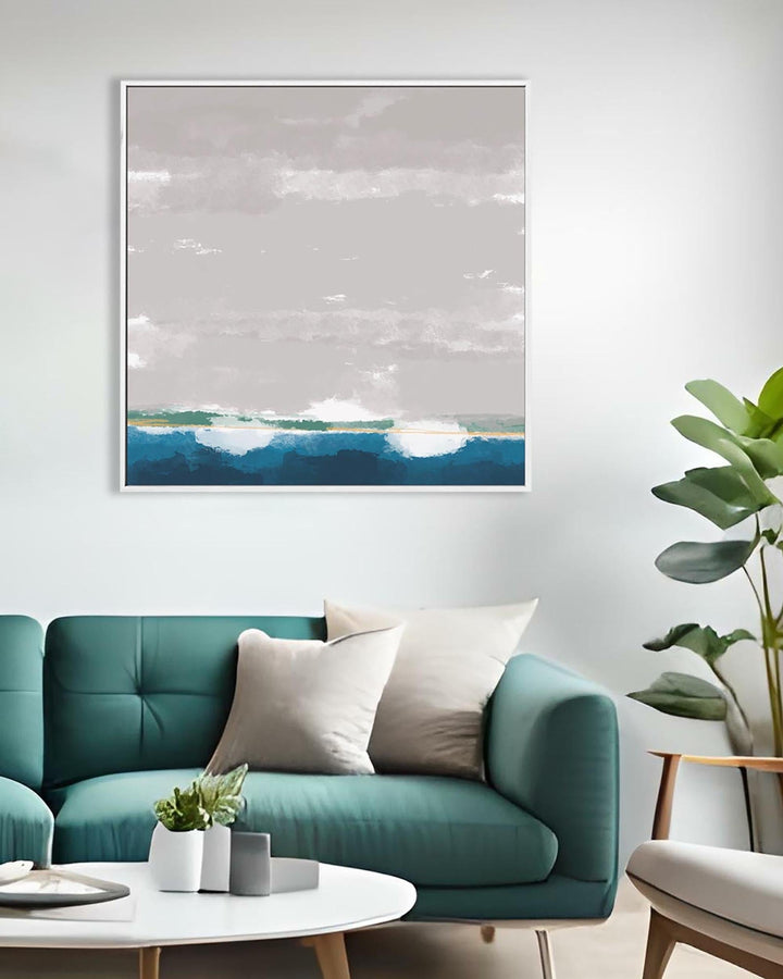 Modern living room with teal sofa, white coffee table, and framed artwork on the wall.