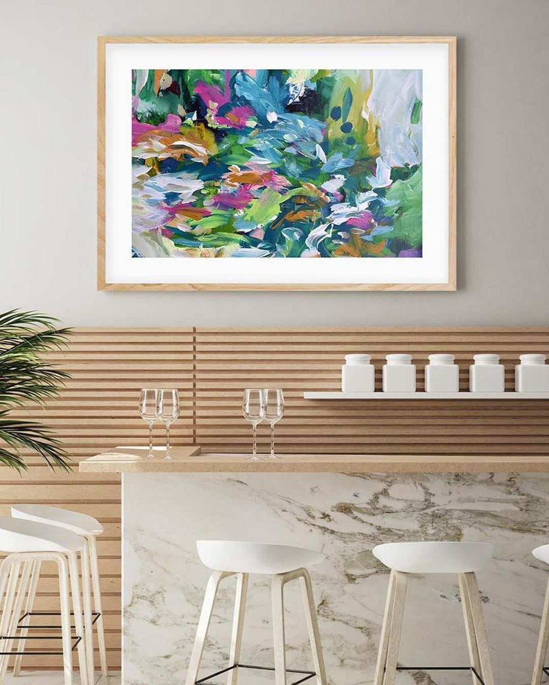 large abstract print on wall in kitchen 